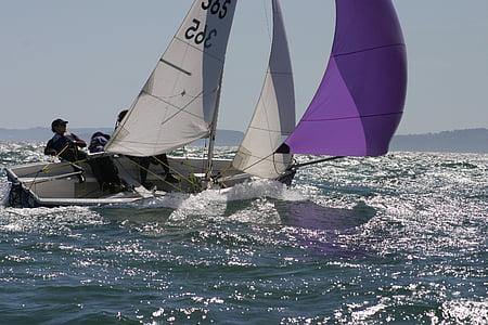person on sailboat during daytime thumbnail