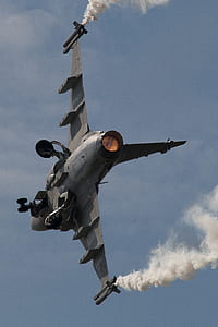 gray fighter plane under blue sky thumbnail