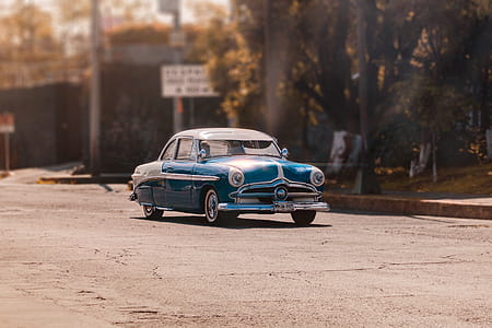 Classic Blue Car on Road thumbnail