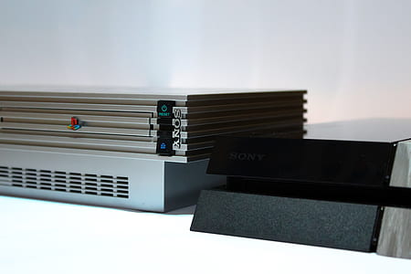 gray Sony PS2 fat console placed on white surface thumbnail