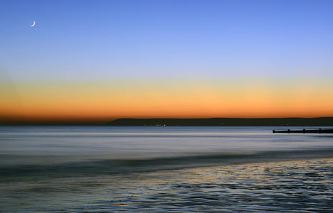 photograph of sea during golden hour thumbnail