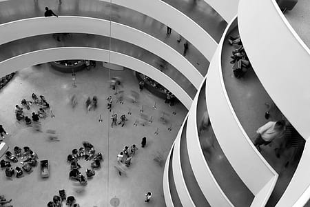 grayscale photo of people in building thumbnail