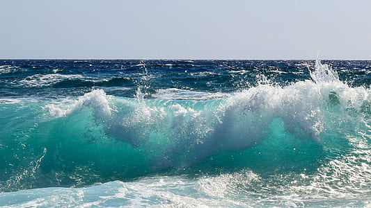 green ocean wave during daytime thumbnail