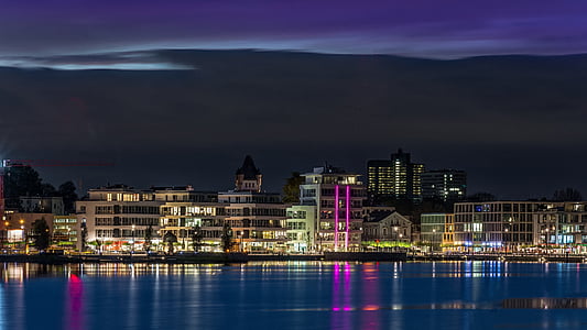 high rise buildings near body of water thumbnail