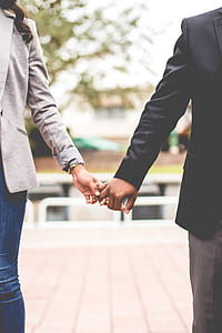 man and woman holding hand thumbnail