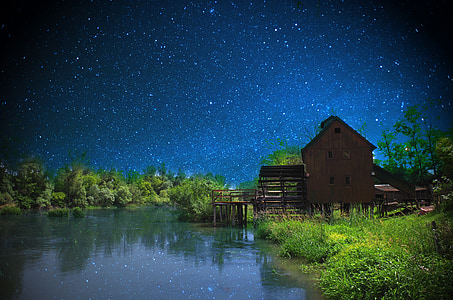 barn near body of water thumbnail