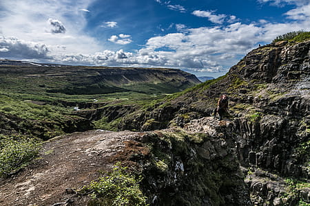 Person Near Mountain Cliff thumbnail