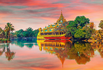 photo of golden temple near body of water thumbnail