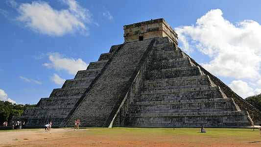 gray concrete temple under blue sky thumbnail