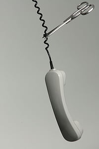 gray and white telephone cord being cut thumbnail