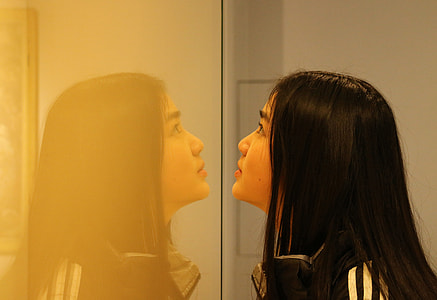woman facing mirror thumbnail