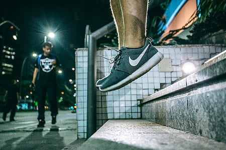 Man in Black White Nike Shoes during Nighttime thumbnail
