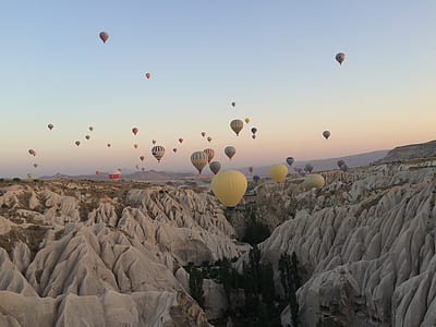 hot-air balloon over white mountain thumbnail