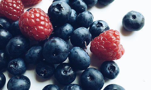 raspberry and blue berry on top of white surface thumbnail