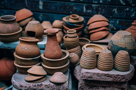 brown clay pots on stone thumbnail