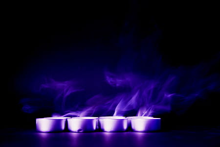 Four Tealight Candles With Purple Background thumbnail