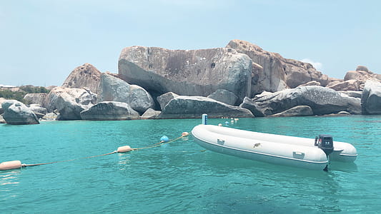 White Inflatable Boat on Body of Water thumbnail
