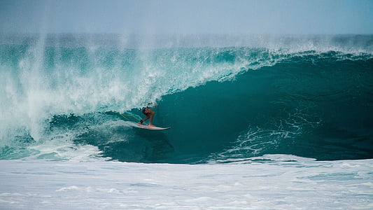 person surfing on blue seawave during daytime time lapse photo thumbnail