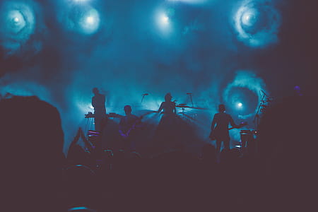 Music Band Performs on Stage during Nighttime thumbnail