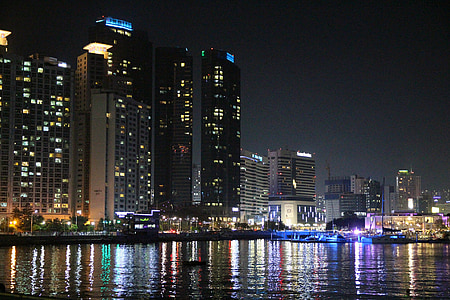 gray high-rise buildings during night thumbnail