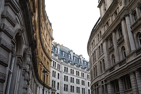 low angle photography of brown concrete buildings thumbnail