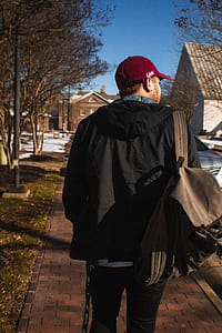Shallow Focus Photography of Man Standing Outdoors thumbnail