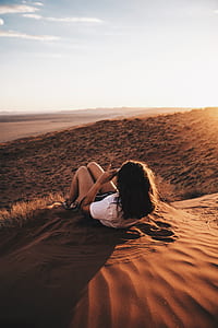 woman lying on sand thumbnail