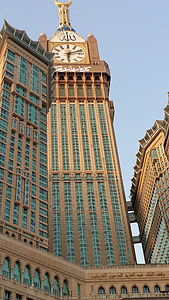 brown concrete tower clock at daytime thumbnail
