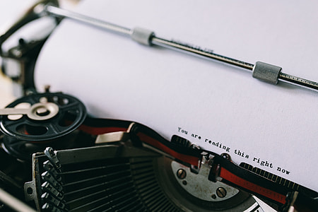 Closeup view of typing quotes on the old typewriter thumbnail