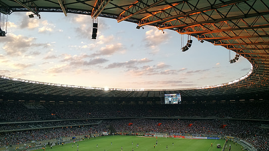 people watching football game in stadium thumbnail