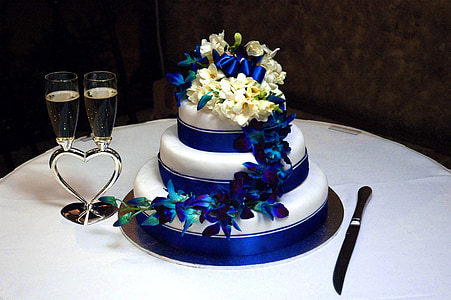 round white 3-layer fondant cake on white table thumbnail