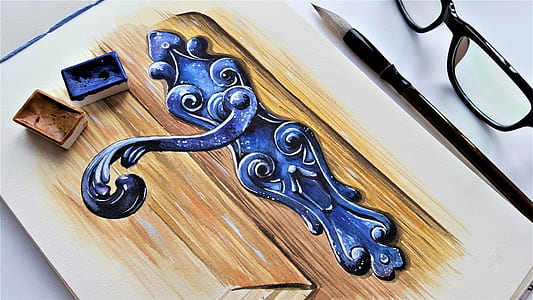 paint brush on top of sketch pad with door lever painting thumbnail