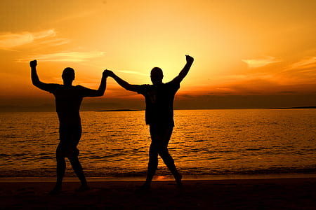 Silhouette People on Beach at Sunset thumbnail