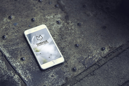 silver iPhone 6 on top of gray metal thumbnail