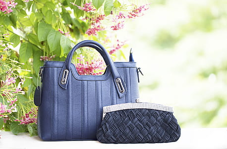 shallow focus photo of women's purple leather handbag thumbnail