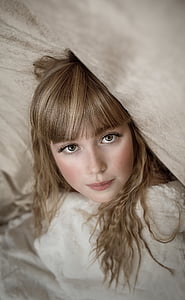 blonde haired woman in gray top thumbnail