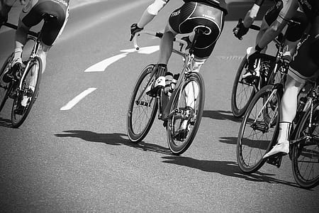 grayscale photography of bikers thumbnail