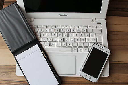 white Asus laptop and white Samsung smartphone thumbnail