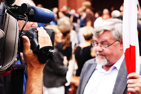 photo of person standing near camera thumbnail