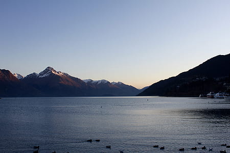 black mountain across body of water thumbnail