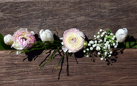 white petaled flowers on a brown wooden crate thumbnail