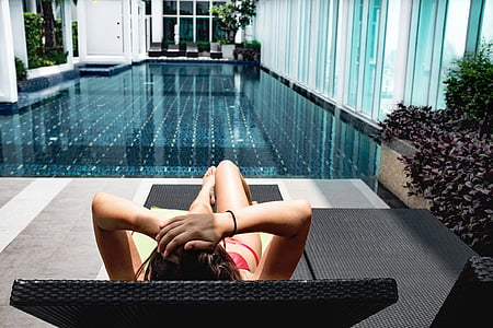 woman laying on black chaise lounge thumbnail