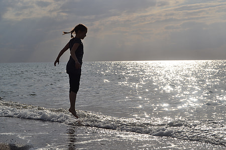 woman jumping on the seashore thumbnail