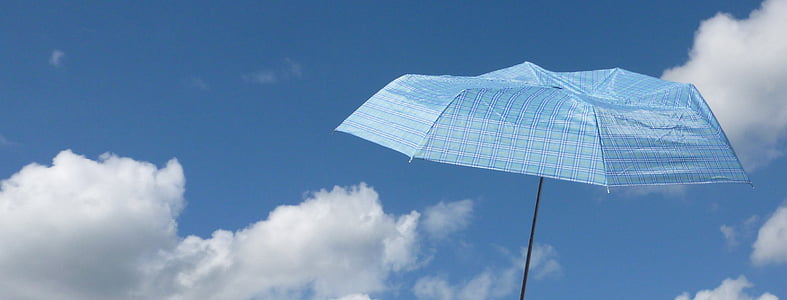 blue umbrella with sky background thumbnail