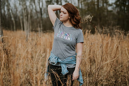 woman wearing gray crew-neck t-shirt standing on grass thumbnail