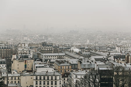 skyscrapers under cloudy sky during daytime thumbnail
