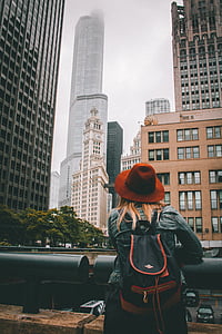 woman in blue denim jacket standing while wearing brown hat thumbnail