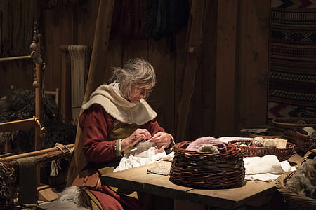 photo of woman stitching white textile thumbnail