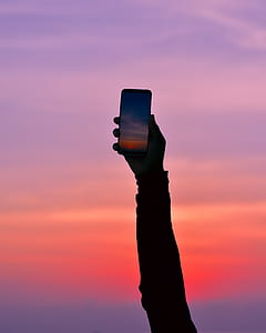 person holding midnight black Samsung Galaxy S8 thumbnail