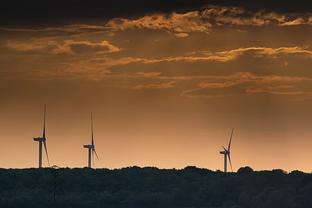 several windmills during sunset thumbnail